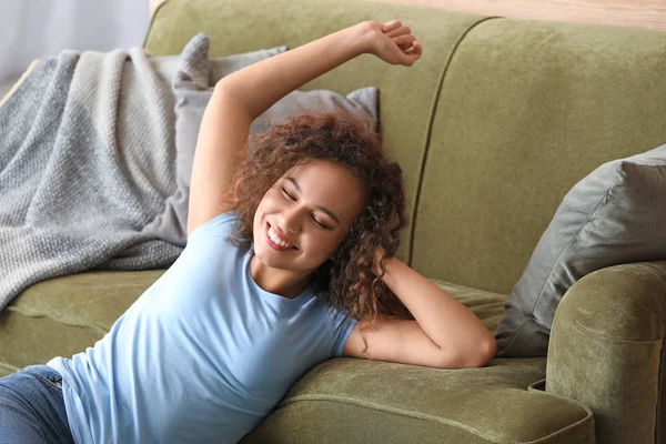 Beautiful African-American woman relaxing at home — Stock Photo, Image
