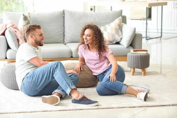 Happy young couple relaxing at home — Stock Photo, Image