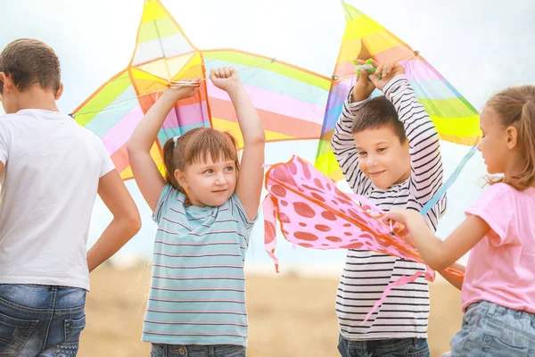 Little children flying kites outdoors — Stock Photo, Image