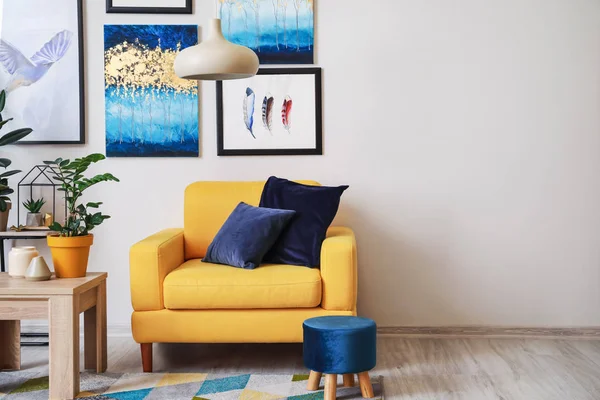 Stylish interior of living room with yellow armchair — Stock Photo, Image