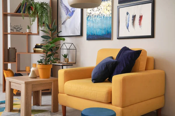 Stylish interior of living room with yellow armchair — Stock Photo, Image