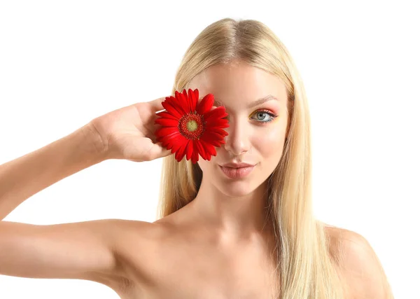 Beautiful young woman with gerbera flower on white background — Stock Photo, Image