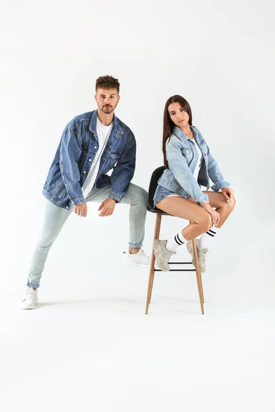 Fashionable young couple on white background — Stock Photo, Image