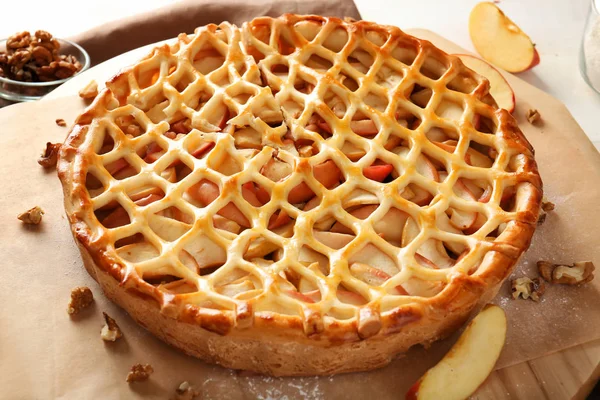 Tasty apple pie on table