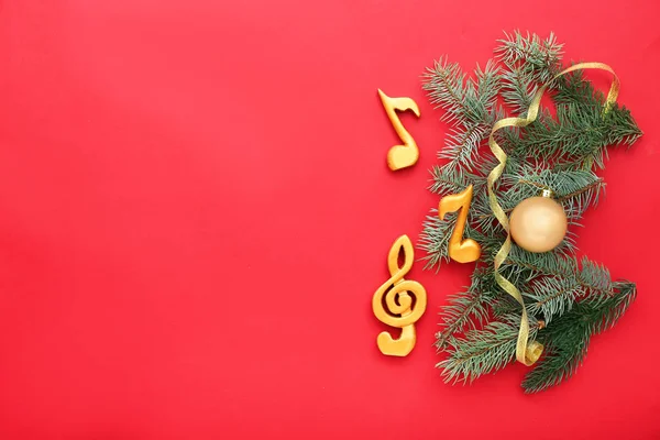 Notes, violin clef and Christmas decor on color background — Stock Photo, Image