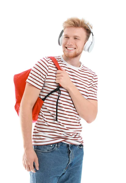 Beyaz arka planda müzik dinlemek yakışıklı genç — Stok fotoğraf