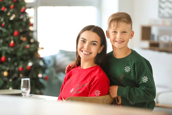 Happy mother and son at table on Christmas eve — Stock Photo, Image
