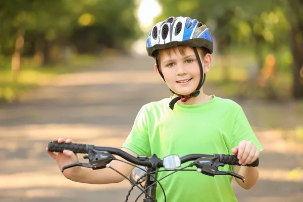 Cute boy riding bicycle outdoors — Stock Photo, Image