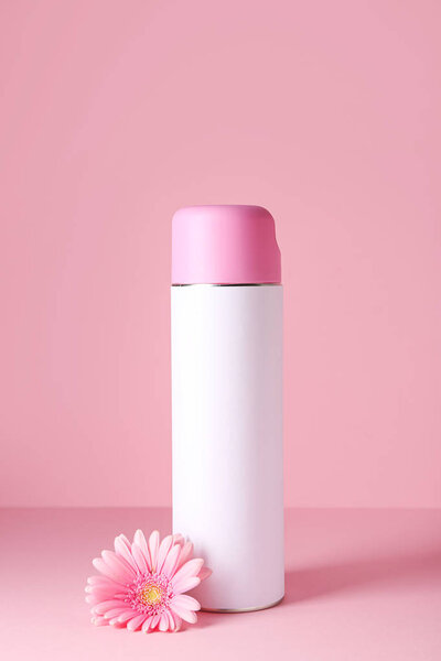 Bottle of air freshener on color background