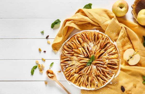 Sweet apple pie on wooden table