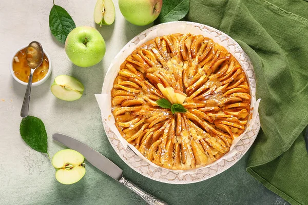 Sweet apple pie on table