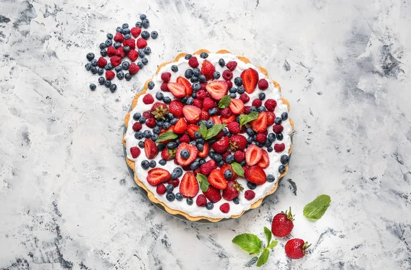 Tasty berry pie on table