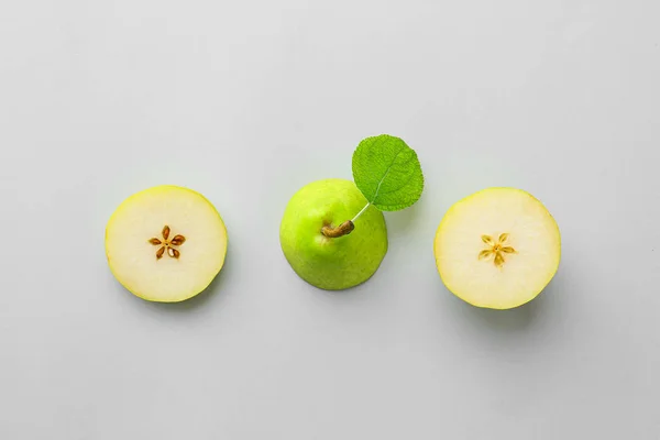 Fresh cut pear on grey background