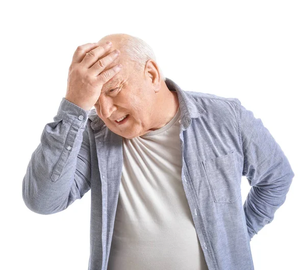 Senior man suffering from headache on white background — Stock Photo, Image