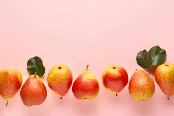 Sweet ripe pears on color background — Stock Photo, Image
