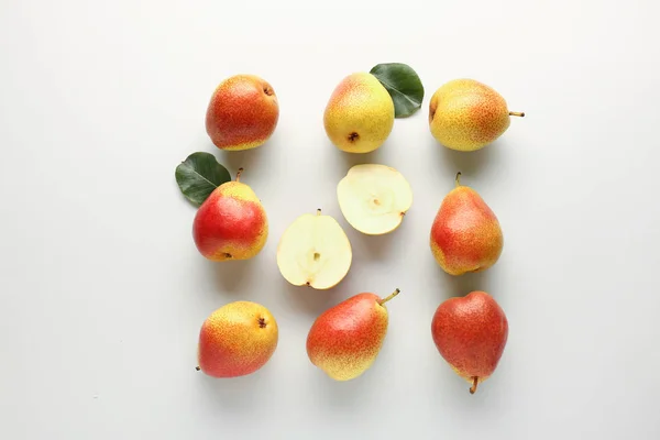 Sweet ripe pears on light background — Stock Photo, Image