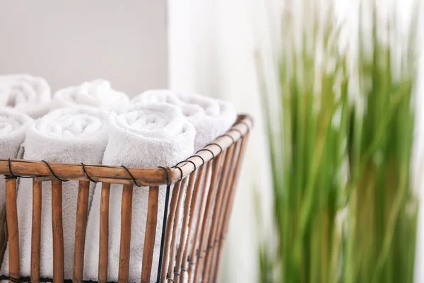 Basket with clean towels in bathroom — Stock Photo, Image