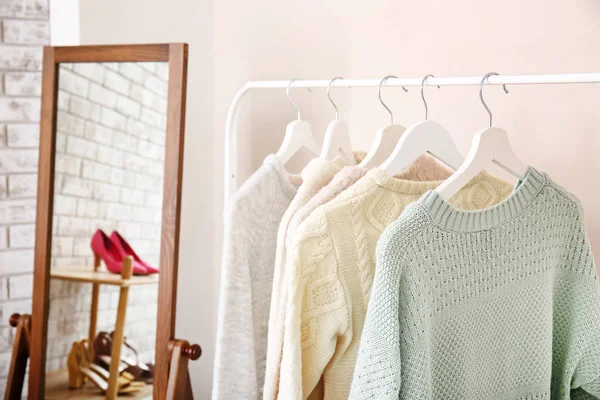 Rack with clean female clothes in dressing room — Stock Photo, Image