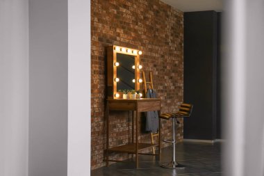 Stylish interior of dressing room, view through reflection in mirror clipart