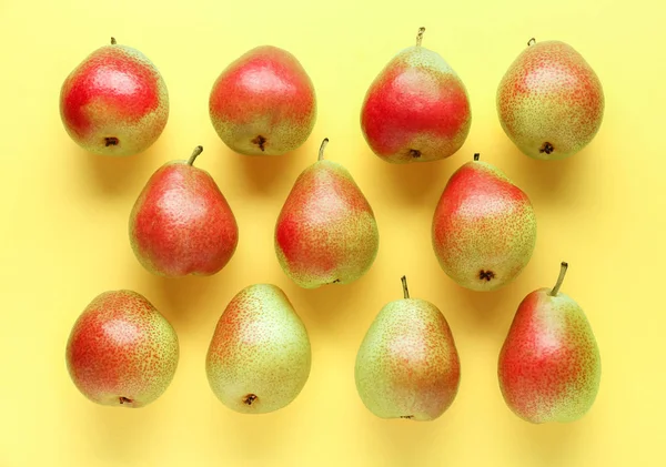 Sweet ripe pears on color background — Stock Photo, Image