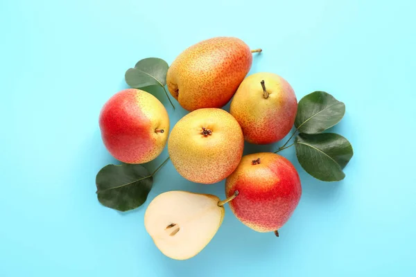 Sweet ripe pears on color background — Stock Photo, Image