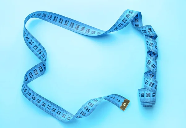 Frame made of measuring tape on color background — Stock Photo, Image