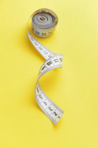 Measuring tape on color background — Stock Photo, Image