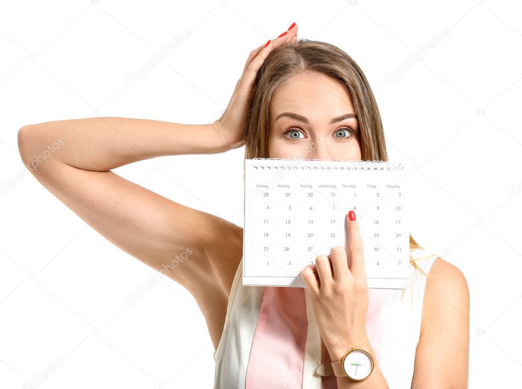 Beautiful young woman with calendar on white background. International Women's Day celebration