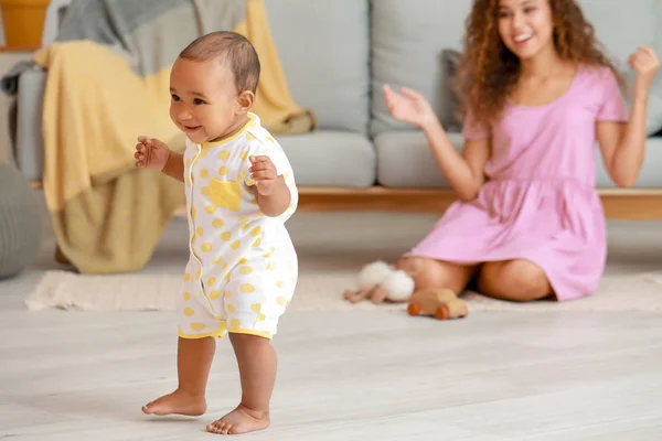 Cute little baby learning to walk at home — Stock Photo, Image