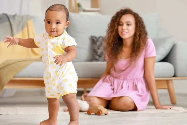 Cute little baby learning to walk at home — Stock Photo, Image