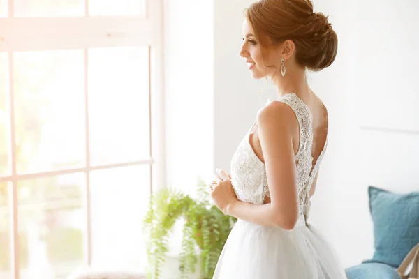 Beautiful young bride before wedding ceremony at home — Stock Photo, Image