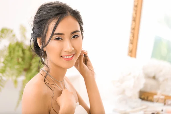 Beautiful young Asian bride at home — Stock Photo, Image