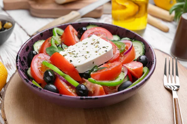 Plate with tasty Greek salad on table — Stock Photo, Image