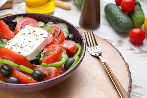 Plate with tasty Greek salad on table — Stock Photo, Image