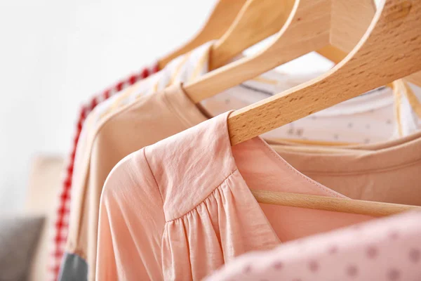 Hangers with stylish clothes, closeup — Stock Photo, Image