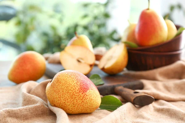 Tasty fresh pears on table