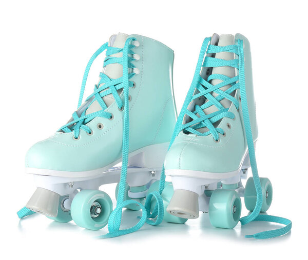 Vintage roller skates on white background