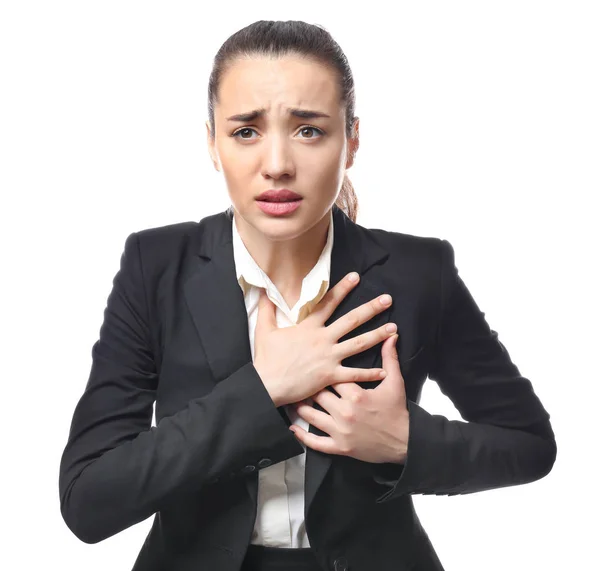 Junge Geschäftsfrau erleidet Herzinfarkt auf weißem Hintergrund — Stockfoto