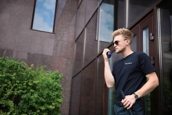 Handsome male security guard outdoors — Stock Photo, Image