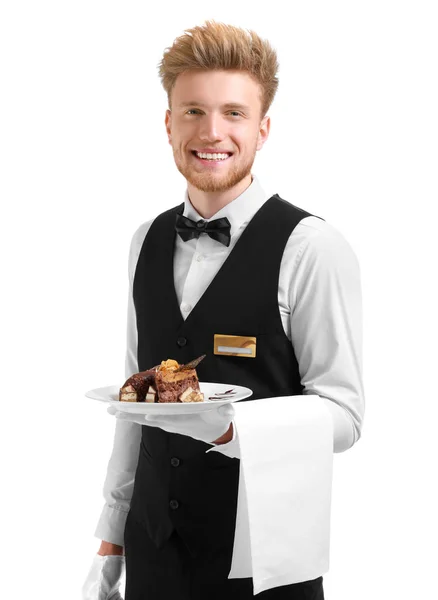 Bel cameriere con dessert su sfondo bianco — Foto Stock