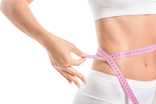 Beautiful young woman with measuring tape on white background, closeup. Weight loss concept — Stock Photo, Image