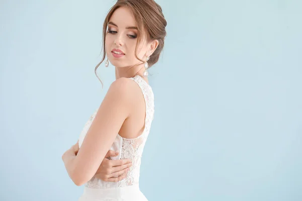 Portrait of beautiful young bride on light background — Stock Photo, Image