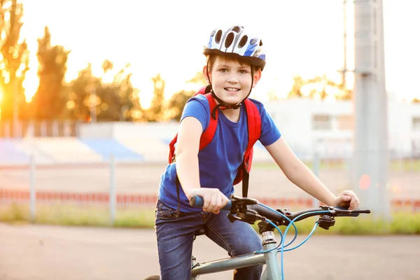 Cute boy riding bicycle outdoors — Stock Photo, Image