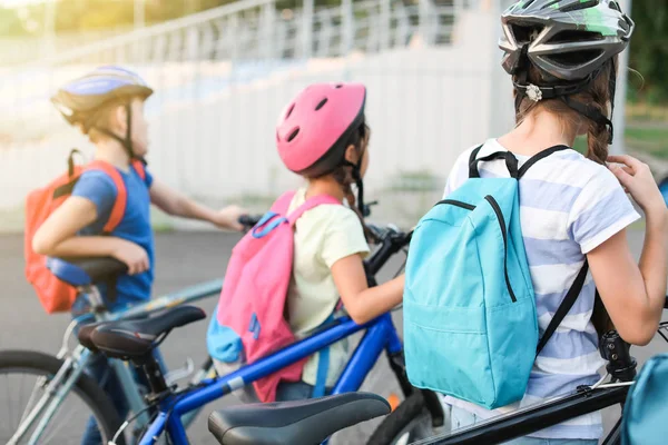 Cute children riding bicycles outdoors — Stock Photo, Image