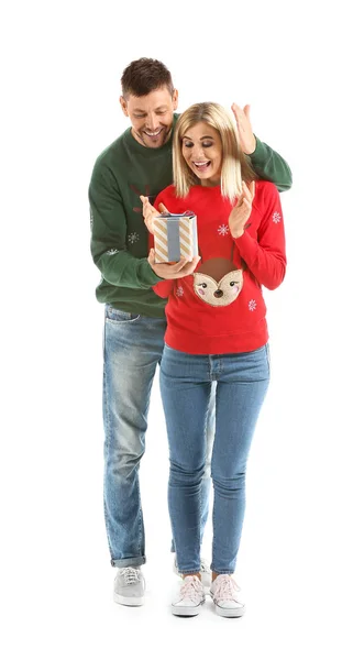 Man giving his wife Christmas present against white background — Stock Photo, Image