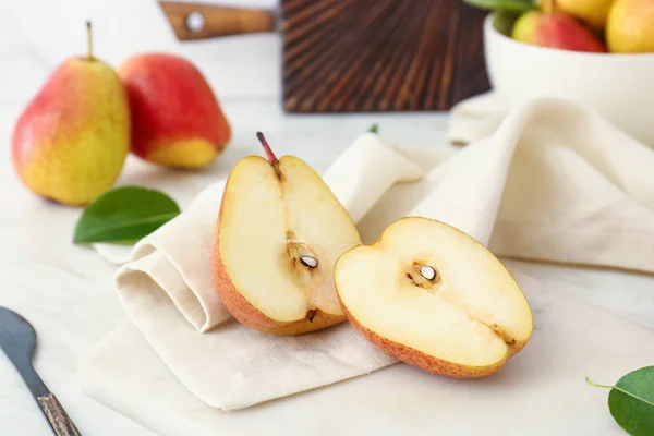 Tasty fresh pears on light table — Stock Photo, Image
