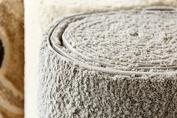 Soft rolled carpet in shop, closeup — 스톡 사진