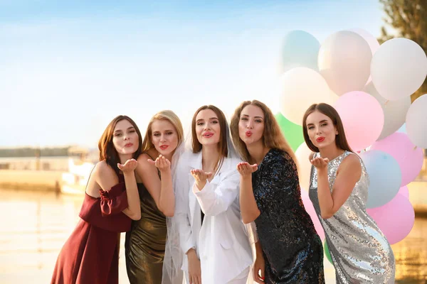 Beautiful young women at hen party near river — Stock Photo, Image