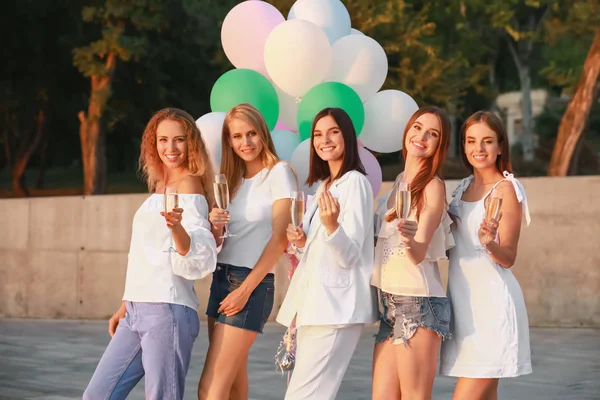 Beautiful young women with champagne at hen party outdoors — Stock Photo, Image