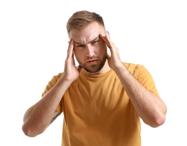 Ung man som lider av huvudvärk på vit bakgrund — Stockfoto